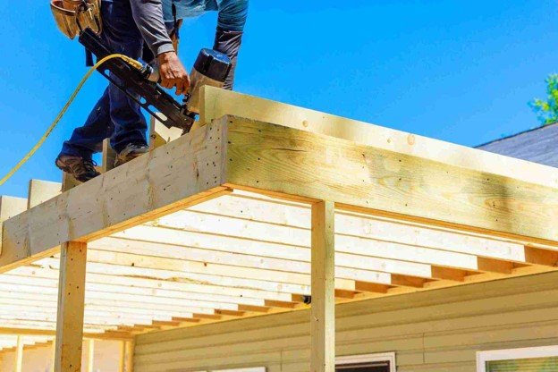 A man working on custom deck construction