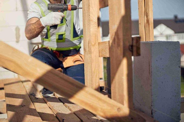 A professional drilling wood for outdoor kitchen construction.